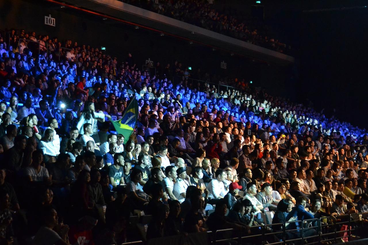 Large audience at a public speaking event. 