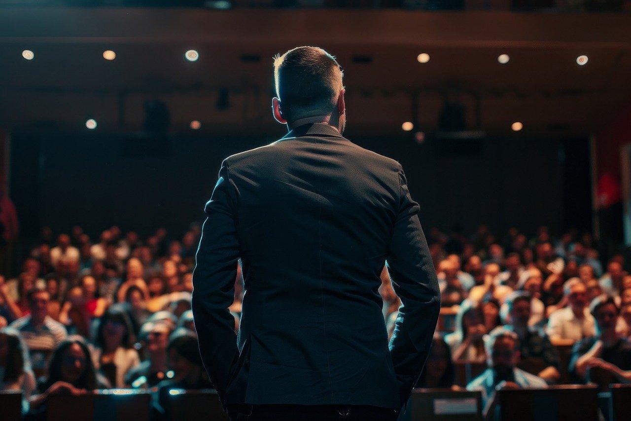 Man standing in front of the crowd at an Corporate Event