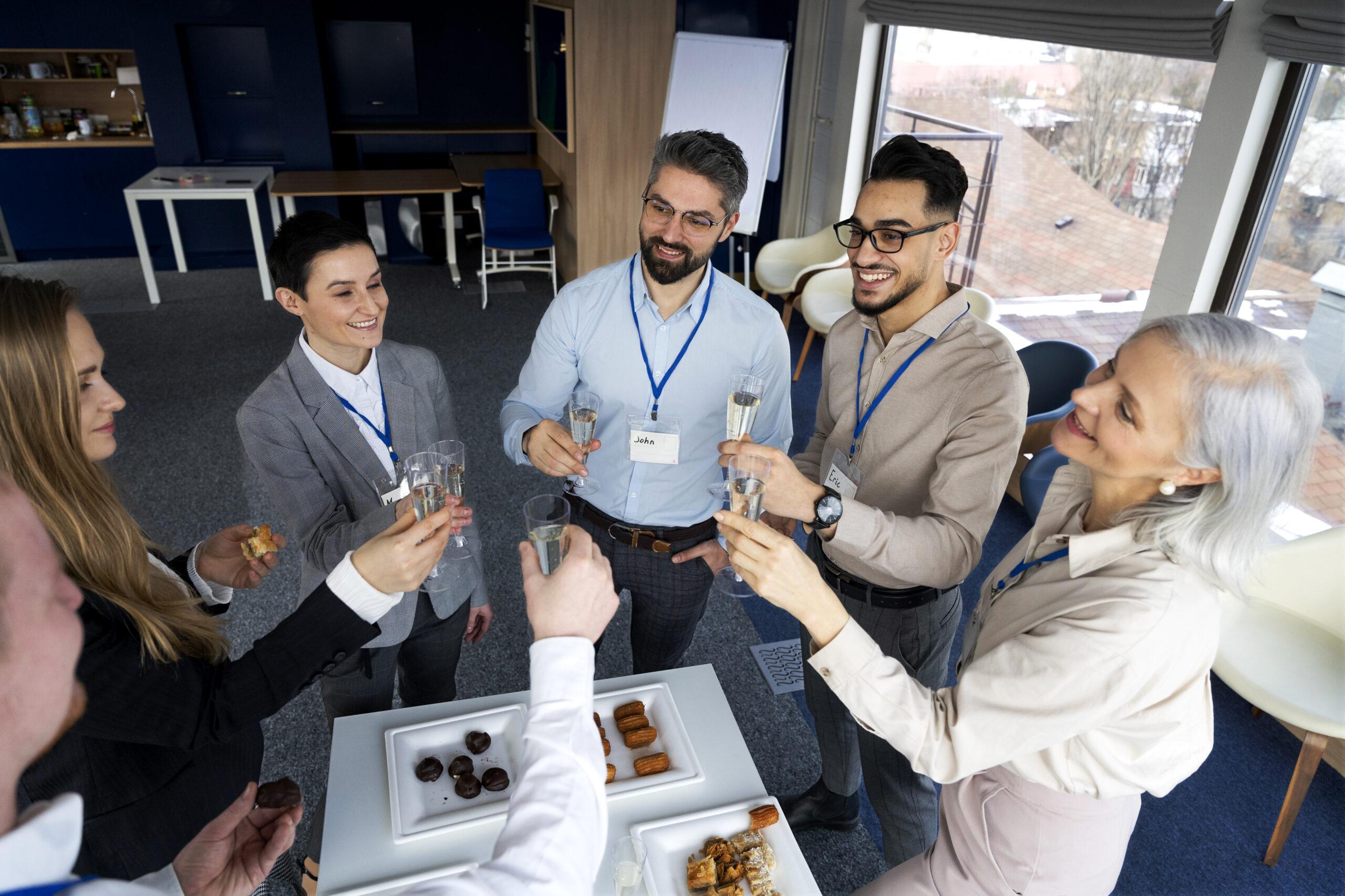 Colleagues celebrating with a toast during a corporate event, showcasing corporate event experience ideas that foster connection and team bonding.