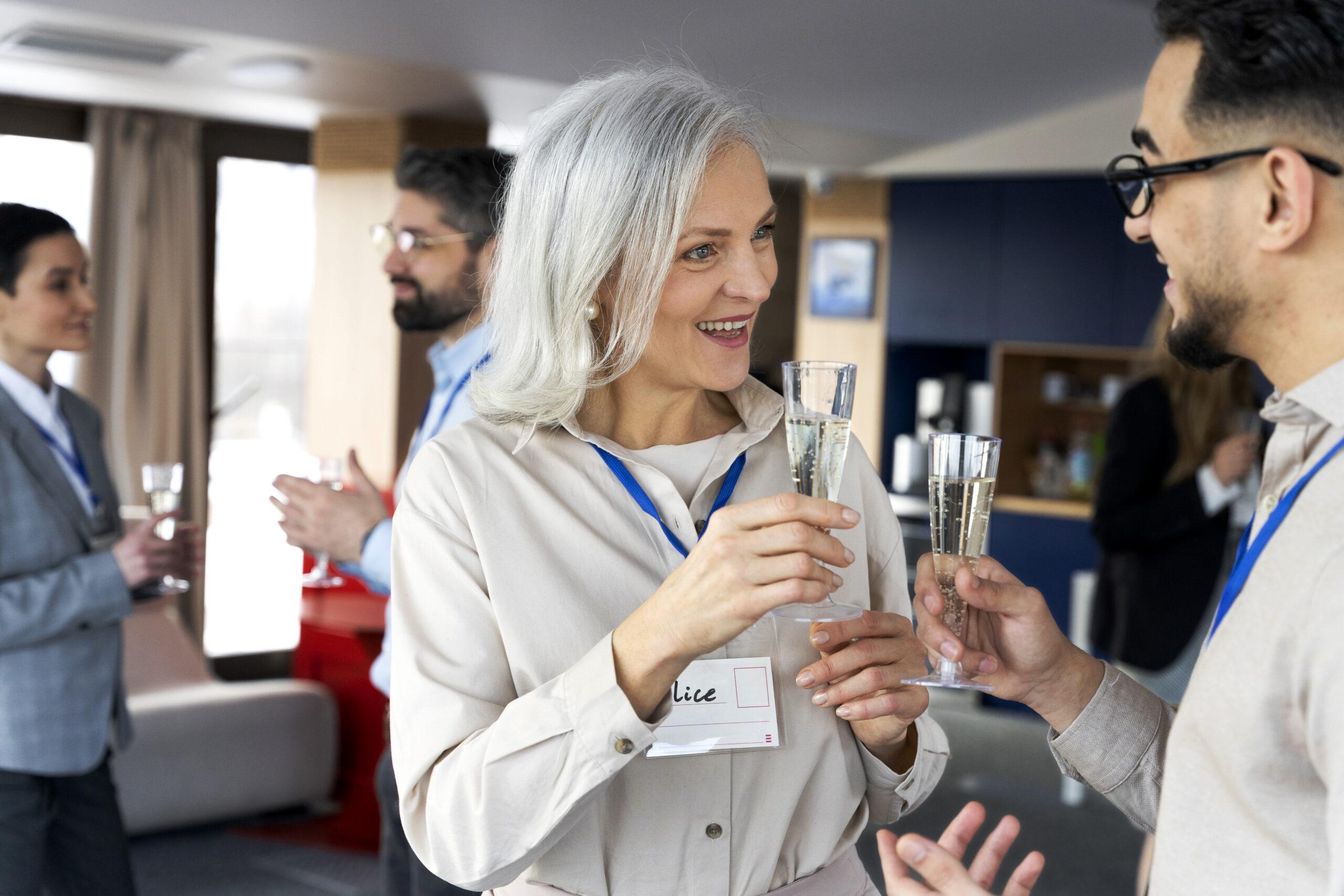 Corporate event attendees taking part in a business event. 